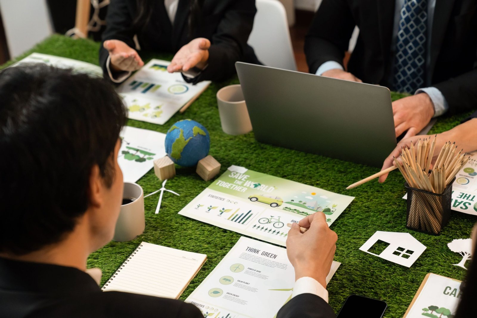 Diverse group of business people planning business marketing with environmental responsibility for greener ecology. Productive teamwork contribute natural preservation and sustainable future. Quaint
